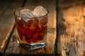 Glass of old whiskey with ice cubes on wooden background. Concept of alcoholic drinks. Advertising and promotion. Bar menu Royalty Free Stock Photo