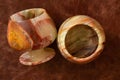 A glass of onyx stone on a colored background close-up