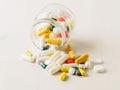 Glass open container with a medicament, jar with pills on white Royalty Free Stock Photo