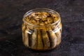 Glass open jar with slots on a concrete background Royalty Free Stock Photo