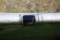 Glass opening on wing of old Douglas Dakota DC-3 WWII plane placed in field at exhibit