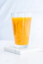 Glass of orange fruit smoothie juice with chia seeds for diet detox, perfect breakfast recipe