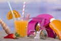 Glass of orange juice with beach accessories Royalty Free Stock Photo