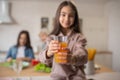 Glass of orange juice in the hands of little girl. Royalty Free Stock Photo
