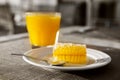 A glass of orange juice and honeycombs Royalty Free Stock Photo