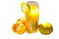 A glass of orange juice with lemons and oranges on it. Royalty Free Stock Photo