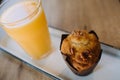 A glass of orange juice with a muffin Royalty Free Stock Photo