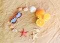 Glass of orange juice, oranges, sunglasses, starfishes and seashells Royalty Free Stock Photo