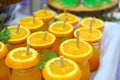 Glass of orange juice, slice of fresh orange on top with paper straw prepared for party