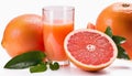 A glass of orange juice and a slice of grapefruit