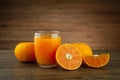 A glass of orange juice and a slice of orange Royalty Free Stock Photo