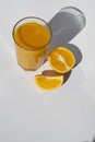 Glass of orange juice with slices orange deep shadows isolated on white background Royalty Free Stock Photo