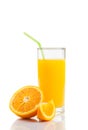 Glass of orange juice with straw near half orange and slice with space for text