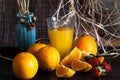 A glass of orange, orange and strawberry juice on a wooden table. Royalty Free Stock Photo