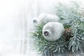 Glass ornaments and spruce branch on a wooden background Royalty Free Stock Photo