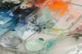 glass palette with a seethrough effect and smudged paints