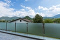 A glass parapet of a modern building balcony overlooking hills Royalty Free Stock Photo