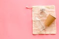 Glass and parer tableware, cotton eco bag on pink background, top view. Zero waste, plastic free concept copy space