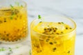 Glass of passion fruit juice on marble table Royalty Free Stock Photo