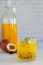 Glass of passion fruit juice on marble table Royalty Free Stock Photo