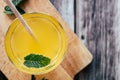 Glass of peach syrup with water and fresh mint - Refreshing drink