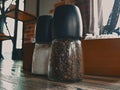 Glass pepper shaker on a wooden table in a cafe Royalty Free Stock Photo