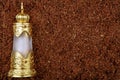 Glass perfume bottle tobacco background Royalty Free Stock Photo