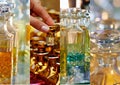 Glass perfume bottles based oils.A Bazaar, market. Macro. Gold and pink gamma. Collage Royalty Free Stock Photo