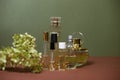 glass perfume bottles with sprigs of hydrangea on a beautiful background Royalty Free Stock Photo