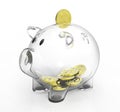 Glass piggy bank with golden coins Royalty Free Stock Photo