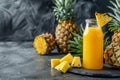 Glass of pineapple juice with a slice and whole pineapple Royalty Free Stock Photo