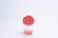 Glass of pink grapefruit juice over white background. Royalty Free Stock Photo