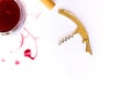 A glass of pink red wine, bottle opener and corkscrew  on white background with Traces of wine. Free copy space. Royalty Free Stock Photo