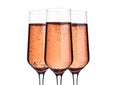 Glass of pink rose champagne with bubbles on white Royalty Free Stock Photo