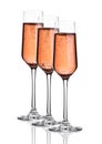 Glass of pink rose champagne with bubbles on white Royalty Free Stock Photo