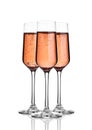 Glass of pink rose champagne with bubbles on white Royalty Free Stock Photo