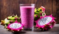 A glass of pink smoothie with a slice of pineapple and a dragon fruit Royalty Free Stock Photo