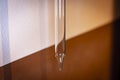 Glass pipette to analyze and test the quality and aging of wine in a cellar Royalty Free Stock Photo