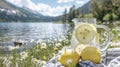 A glass pitcher filled with icecold water and lemon slices is the refreshing centerpiece of a picnic overlooking a