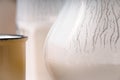 Glass, pitcher, yellow cup of kefir close-up Royalty Free Stock Photo