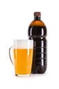 Glass and plastic bottle of dark draft beer on white Royalty Free Stock Photo