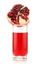 Glass of pomegranate juice with sliced fruits