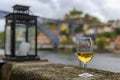 Glass of port wine with the blurred cityscape of Porto Portugal and a lantern in the background Royalty Free Stock Photo