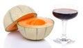 Glass of porto wine with a melon cut in half Royalty Free Stock Photo