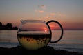 Herbal teapot and sunset