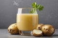 Glass of Potato Juice with Its Ingredients In Close-up On a Gray Background