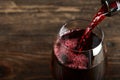 In a glass pour red wine Royalty Free Stock Photo