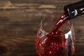 In a glass pour red wine Royalty Free Stock Photo