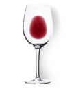 Glass with poured red wine lying on the white background, top view Royalty Free Stock Photo