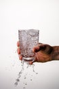 Glass with pouring water, bubbles Royalty Free Stock Photo